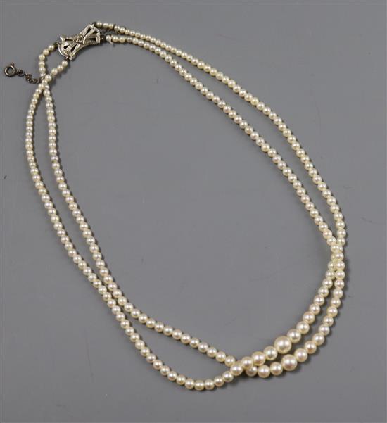 A double strand graduated cultured pearl choker necklace with diamond set 9ct white gold clasp, 38cm.
